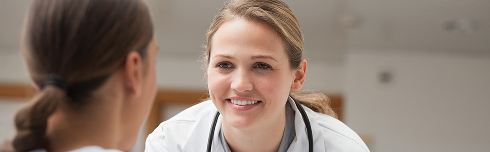 Doctor smiling talking to patient