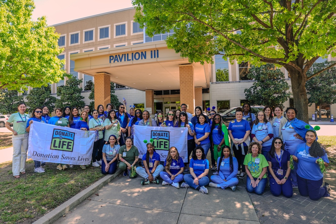 A group of people outside the Pavilion III for the Transplant Support Group