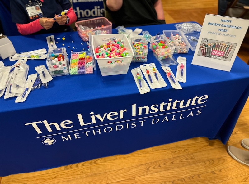 A close up of all the beads on the table for the DIY pen-making station
