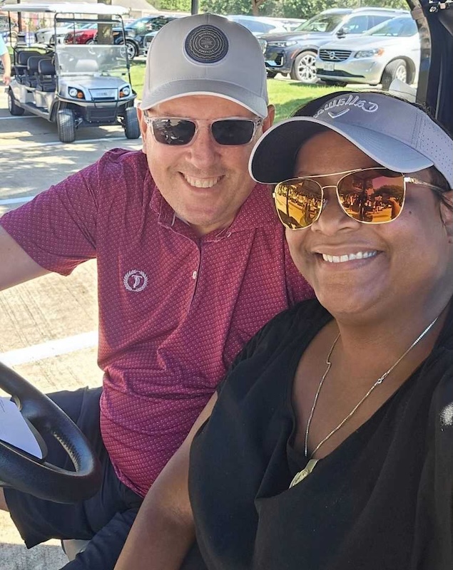 Joe Gammon and Dr. Barnes on a golf cart