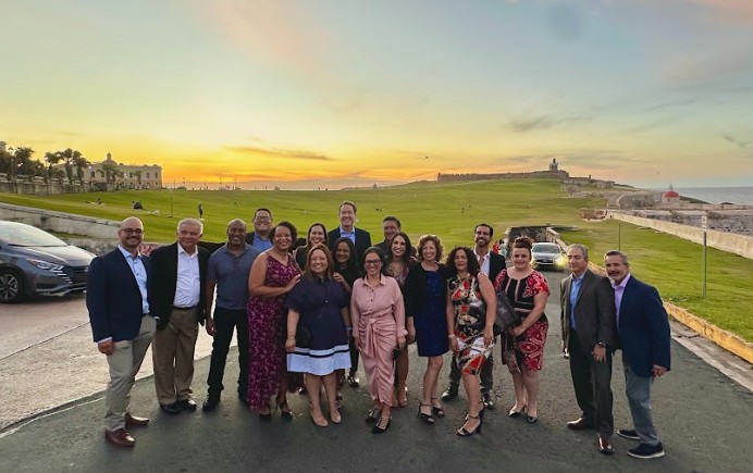 All of the presenters at the symposium huddled together for a group shot